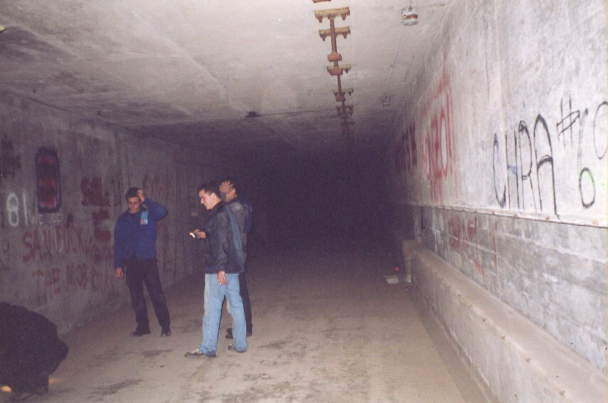 In the large hallway that ran the length of the complex.