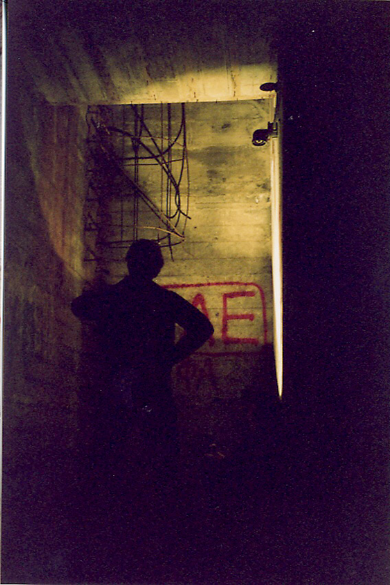 The bottom of the concrete entry shaft and ladder. It's easy to forget, looking at pictures, that we explored this all by flashlight, not by camera flash, and the whole experience looked much more like this photo than the others.