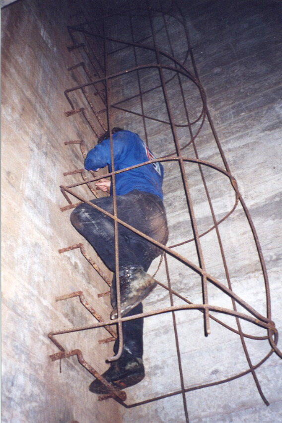 The climb back to the surface, up a ladder up to a former lookout point. Since the complex was buried, the lookout point at the top of this shaft is now buried under several feet of dirt, and since about 20 years ago, concrete also, making us among the last people to see the inside of this place..